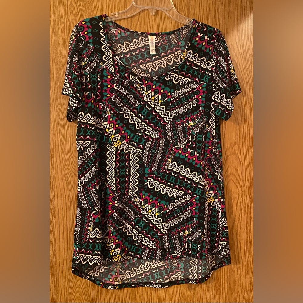 LuLaRoe multi colored women’s top. Size small